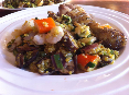 Paella van quinoa met zeevruchten